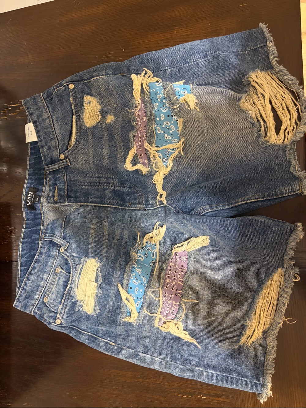 Men’s Distressed Blue Denim Shorts with Bandana Patch -